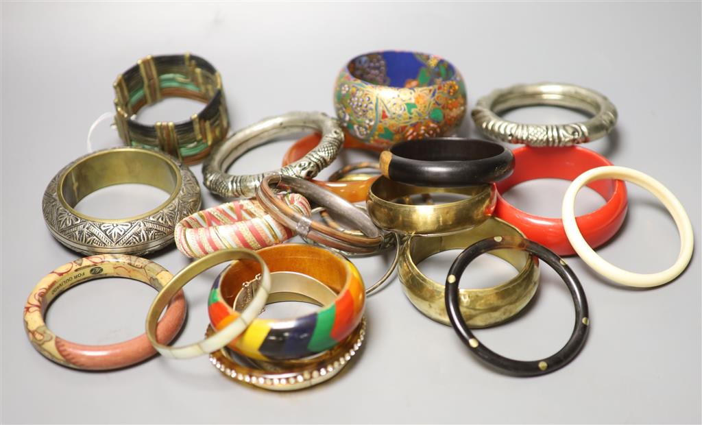 A collection of bangles, including five ethnic white metal examples,